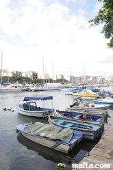 Small luzzu onshore the Msida Marina